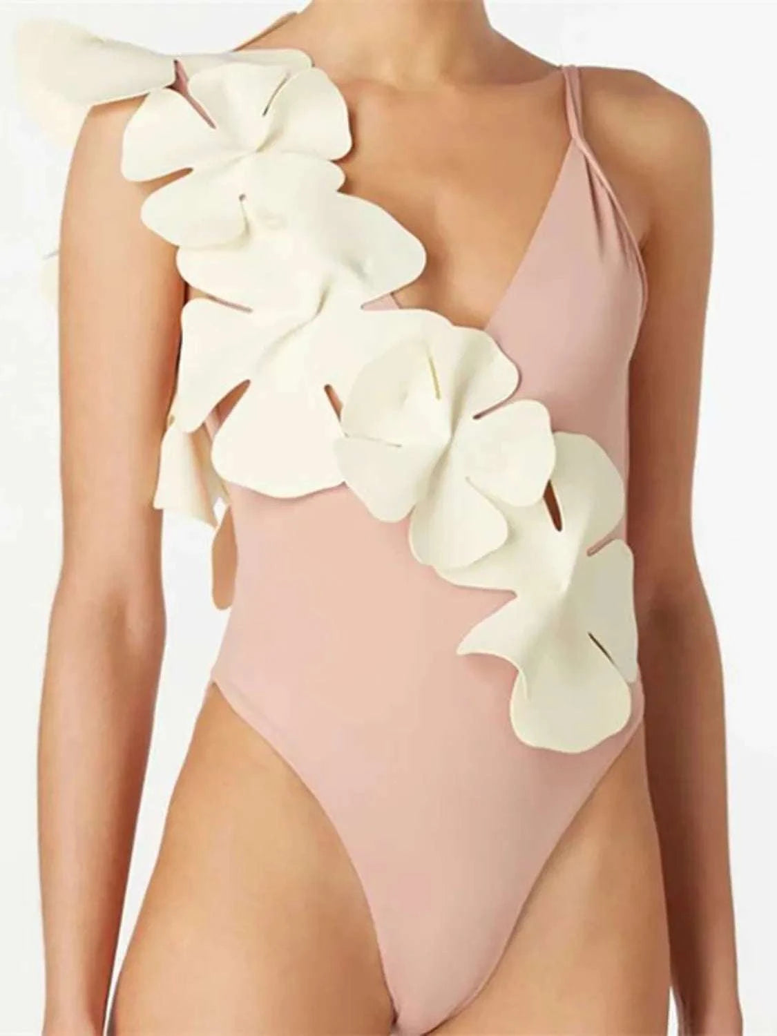 Close-up fabric detail of floral one-piece swimwear
