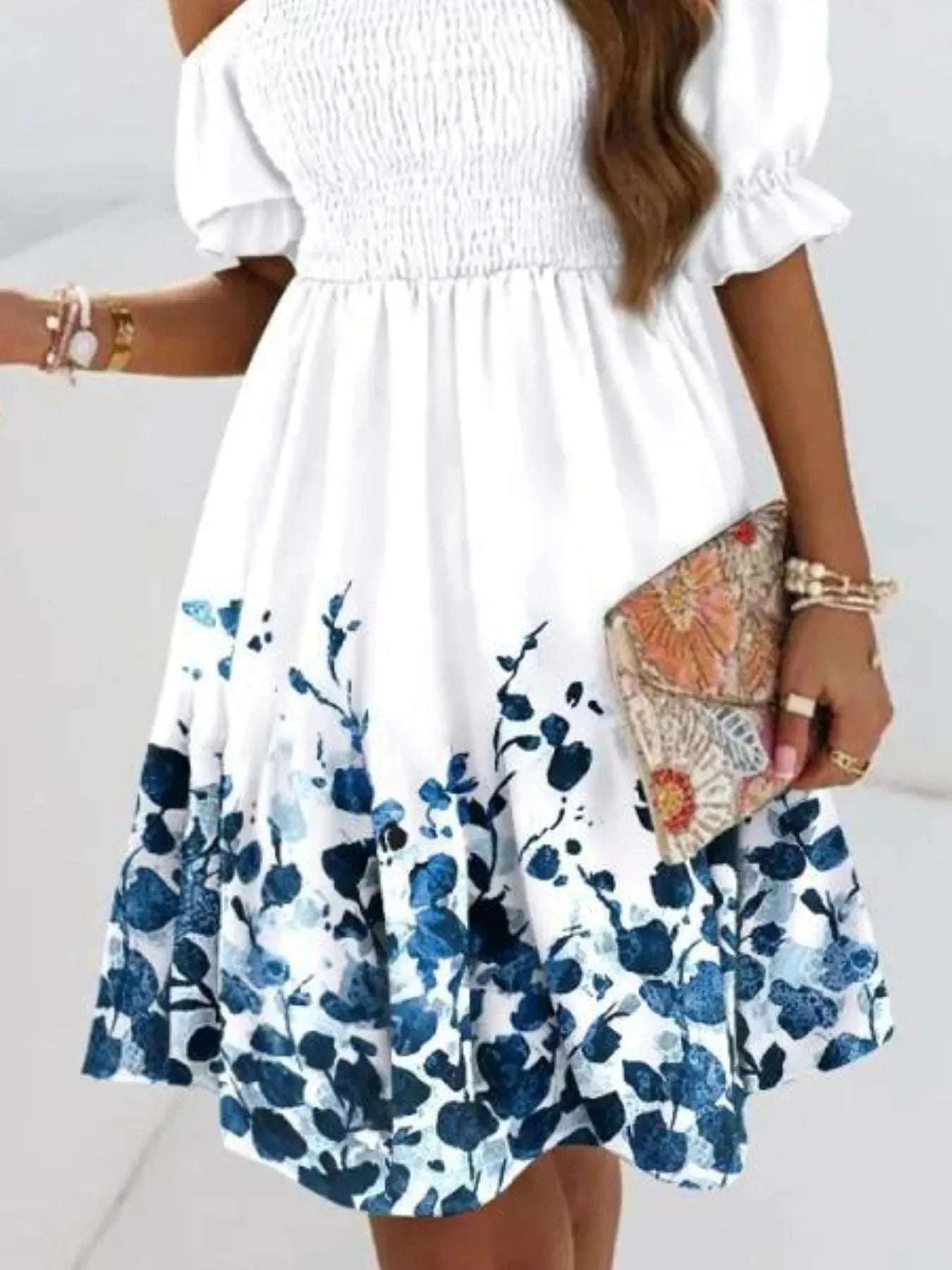 Close-up of white blue flower printed smocking dress for women