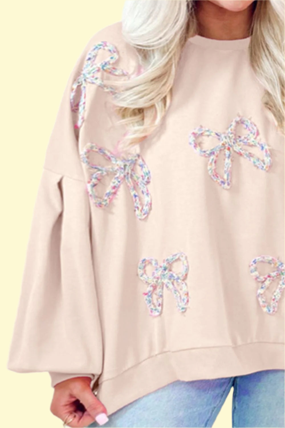 Cream long sleeve pullover with feminine bow detail by WestCloset