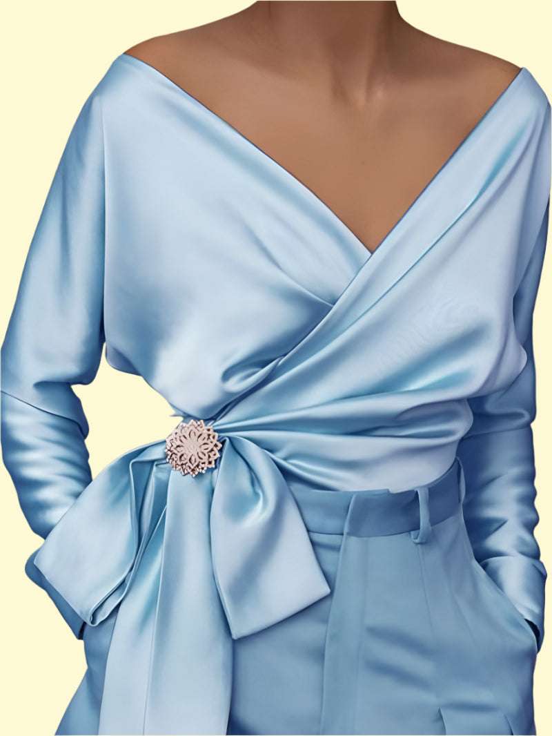 Light blue wrap blouse with elegant long sleeves