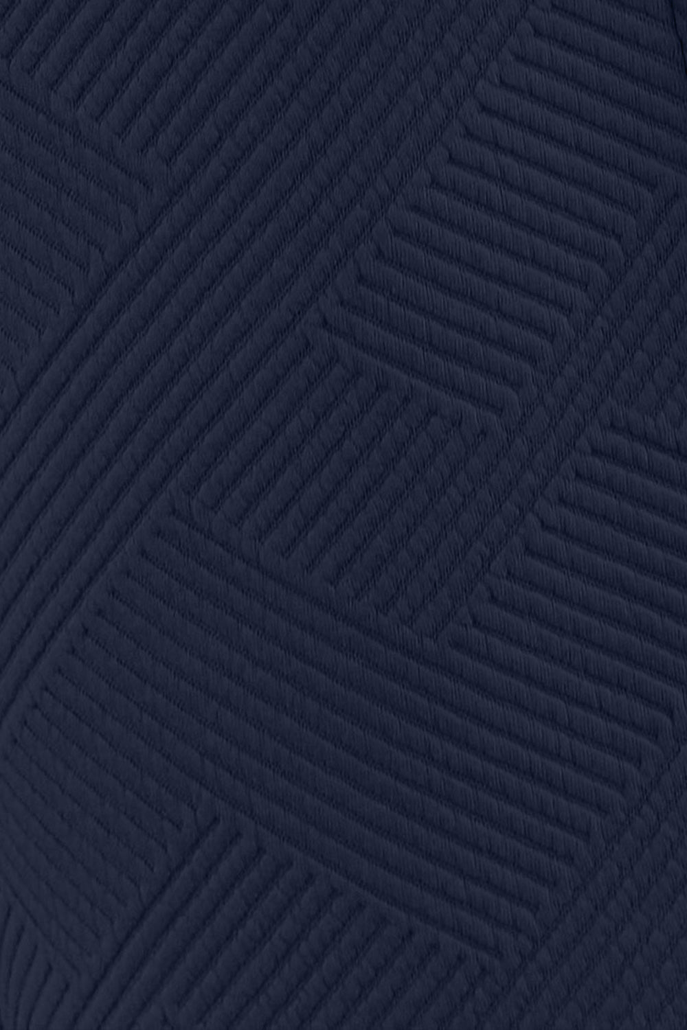 Close-up of the soft, slouchy fabric of the navy set