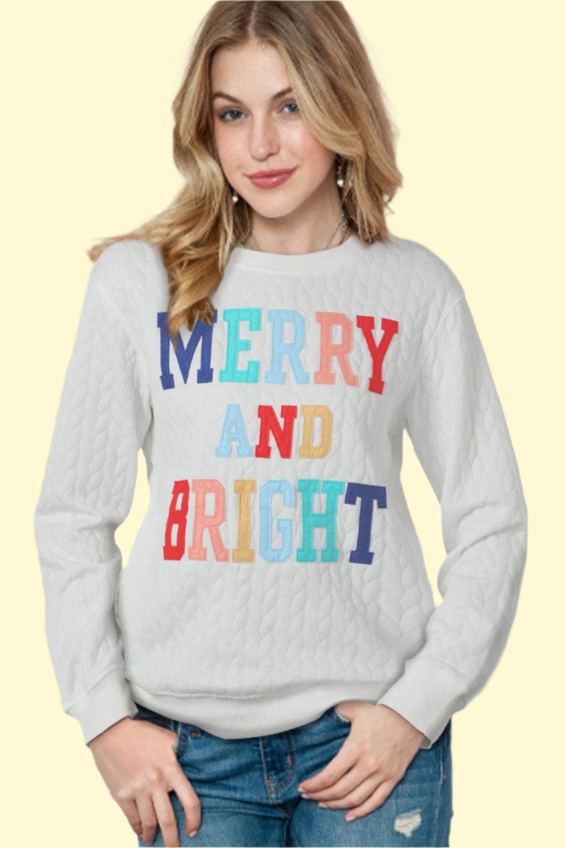  Model wearing a white knit sweater, seductively posing