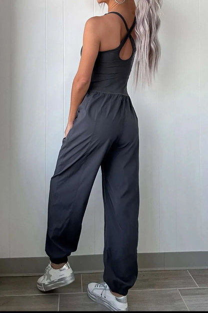 Back view of women cutout crisscross active jumpsuit