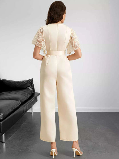Back view of women’s lace trim jumpsuit with belt
