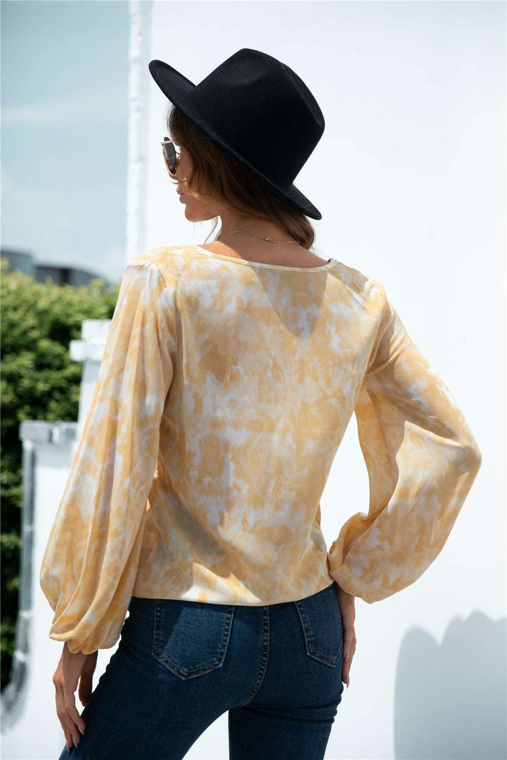Back view of women’s tie dye casual blouse