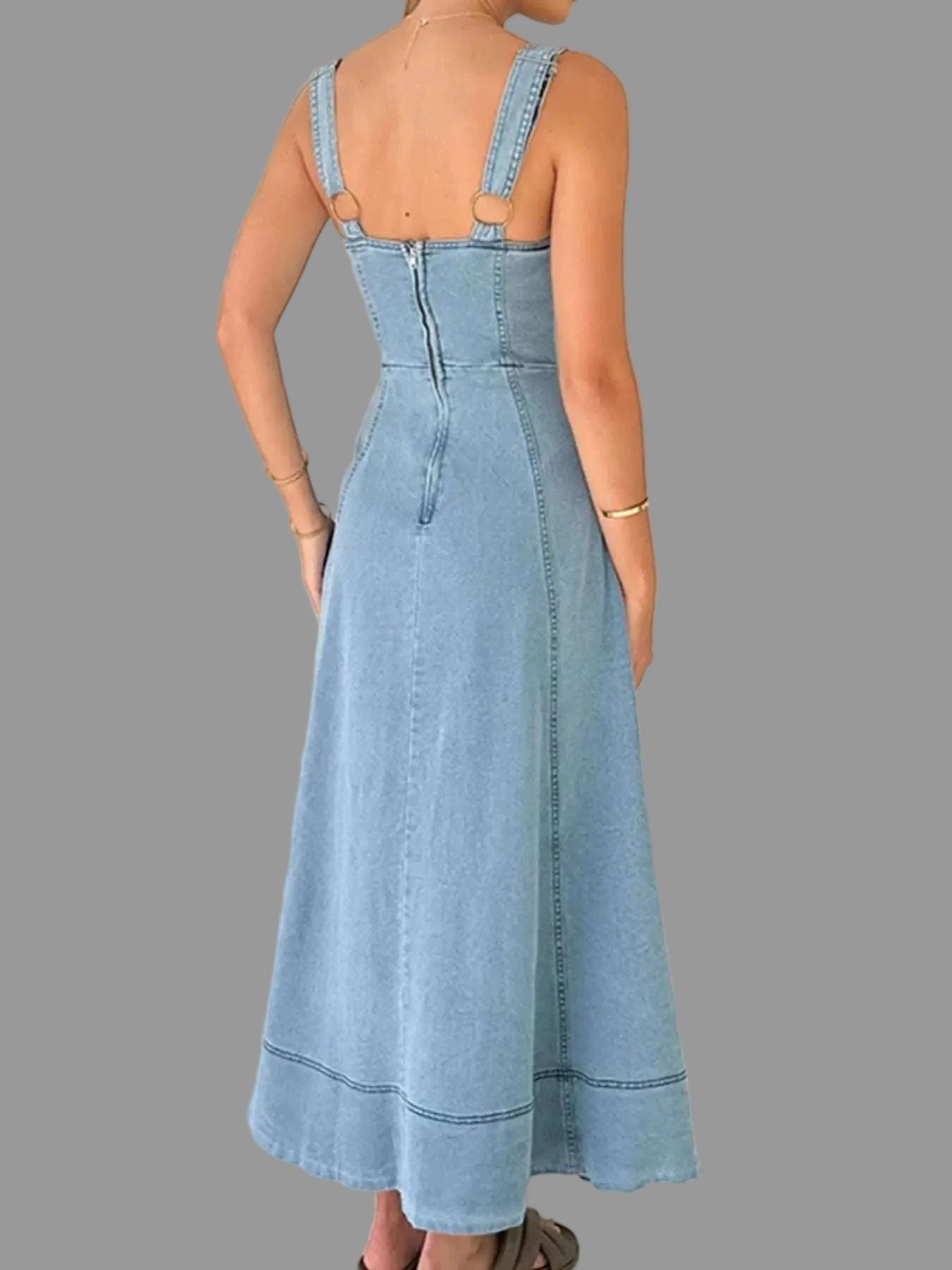 Back view of women’s wide strap denim mini dress