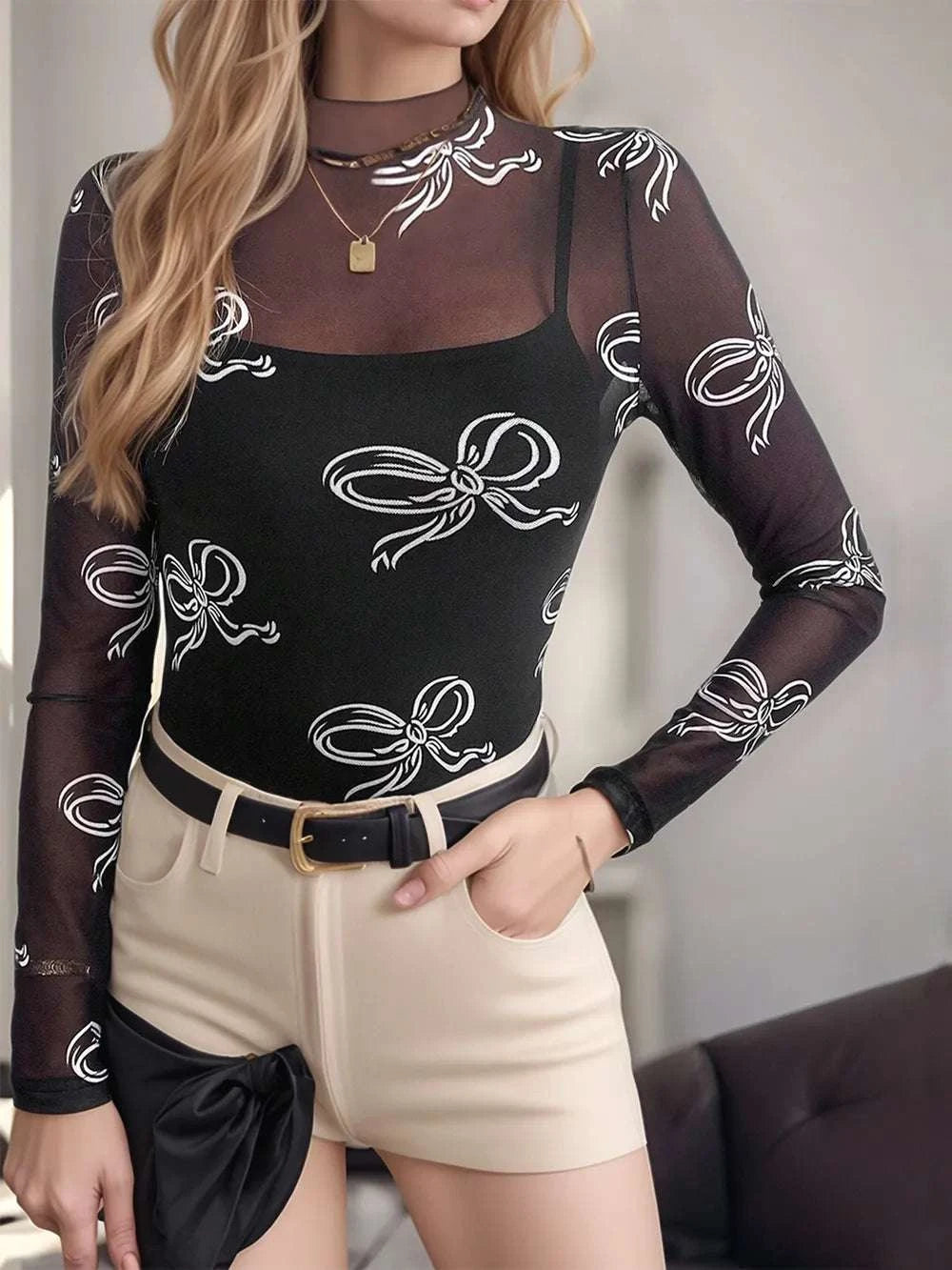 Black printed mesh mock neck top for women online