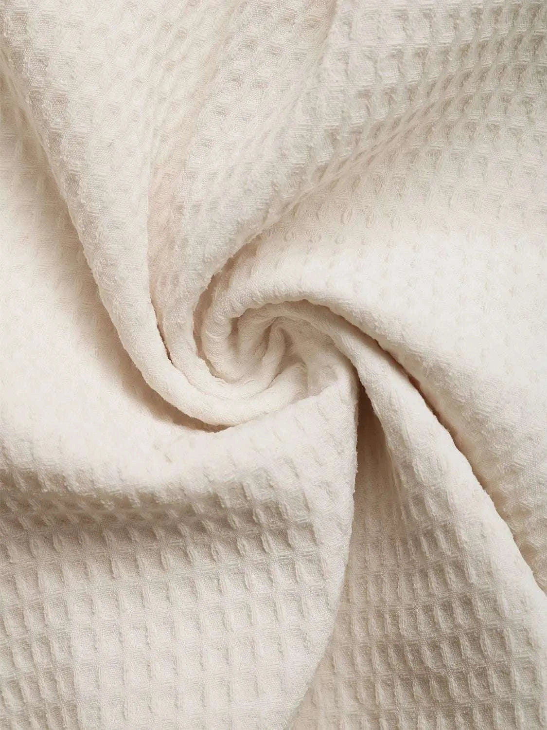 Close-up fabric texture of beige women romper