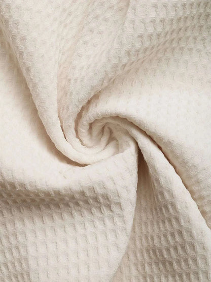Close-up fabric texture of beige women romper