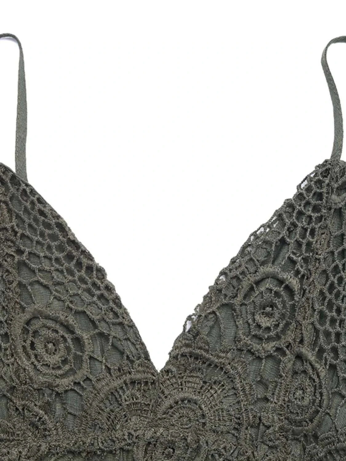 Close-up lace detail on women’s spaghetti strap romper