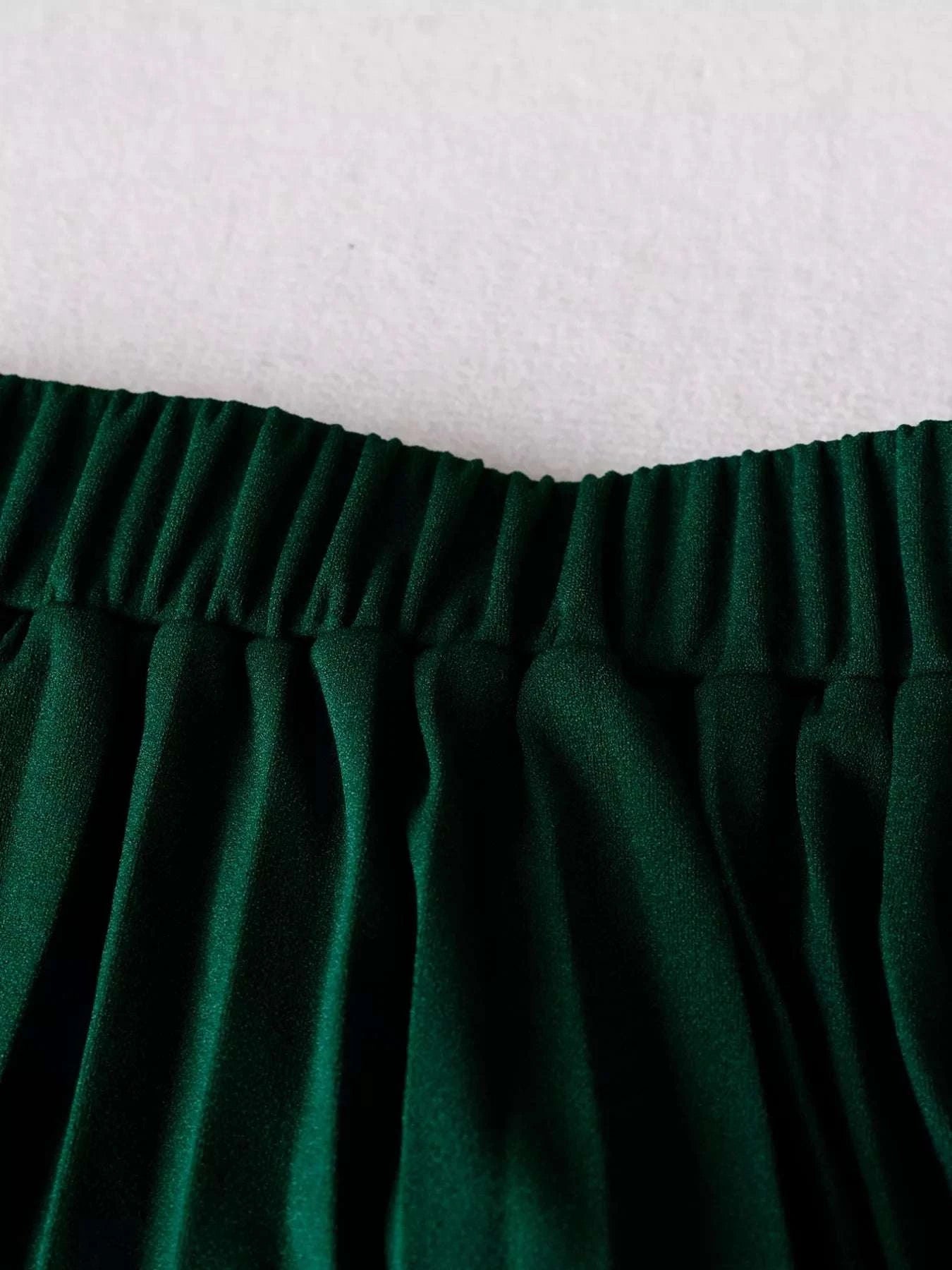 Close-up of a green skirt elastic waist