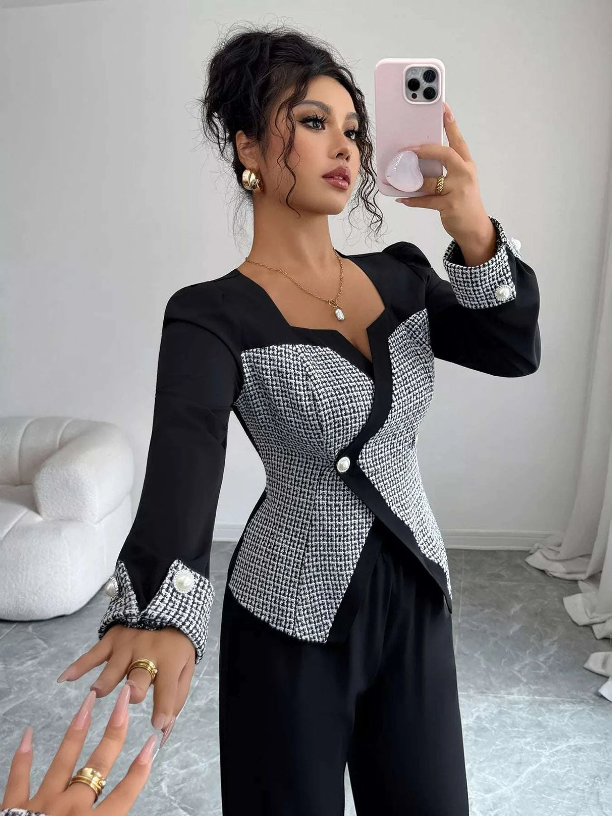 Close-up of buttoned detail on women co ord top