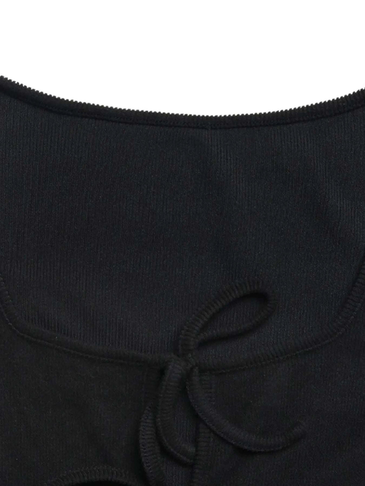 Close-up of lace-up cutout detail on black jumpsuit