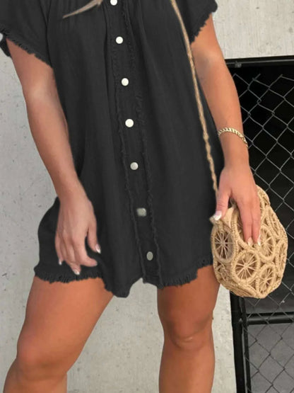 Close-up of raw hem detail on denim mini dress