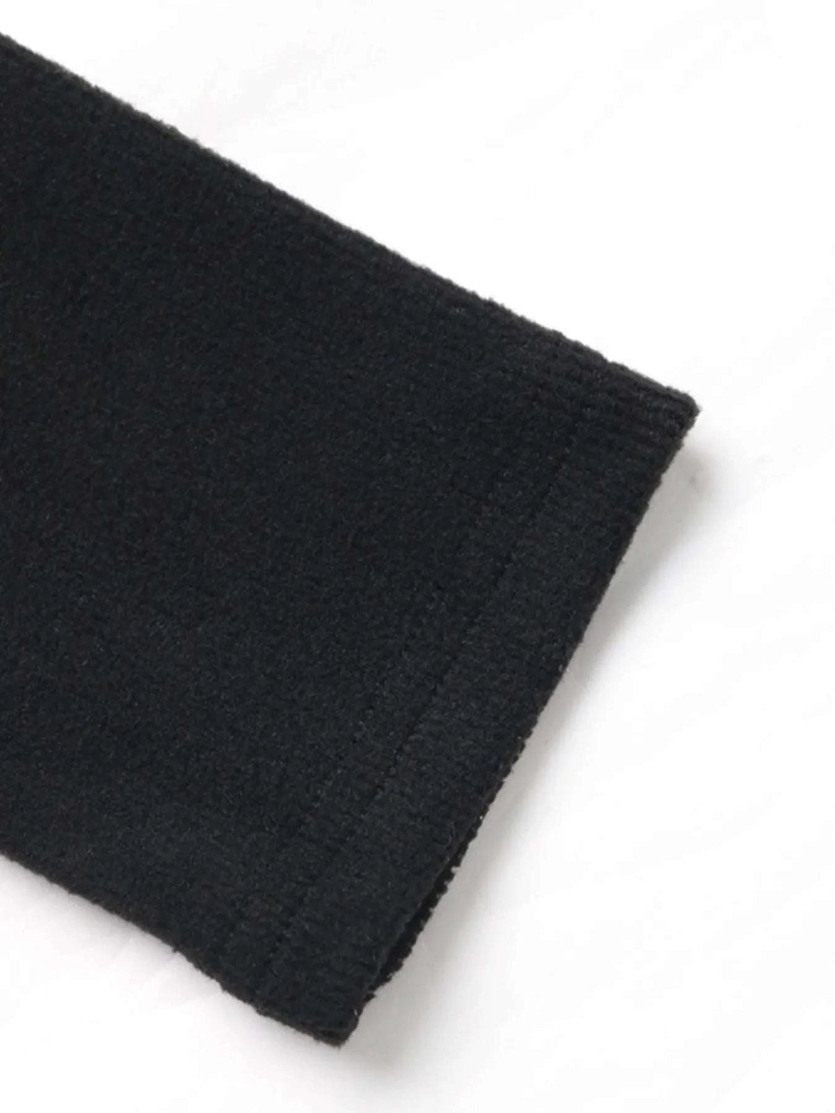 Close-up of sleeve detail of long sleeve flare jumpsuit