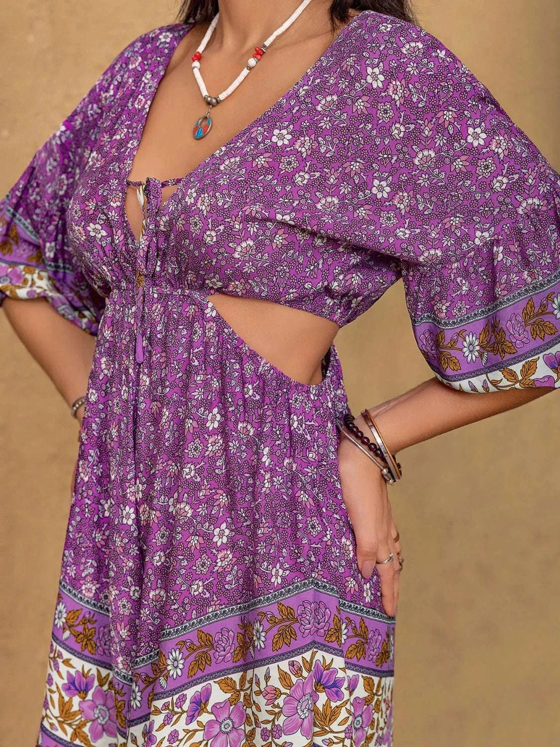 Cutout design detail on women’s purple romper