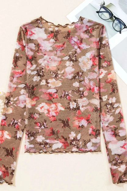 Detail view of mock neck floral sheer women’s top