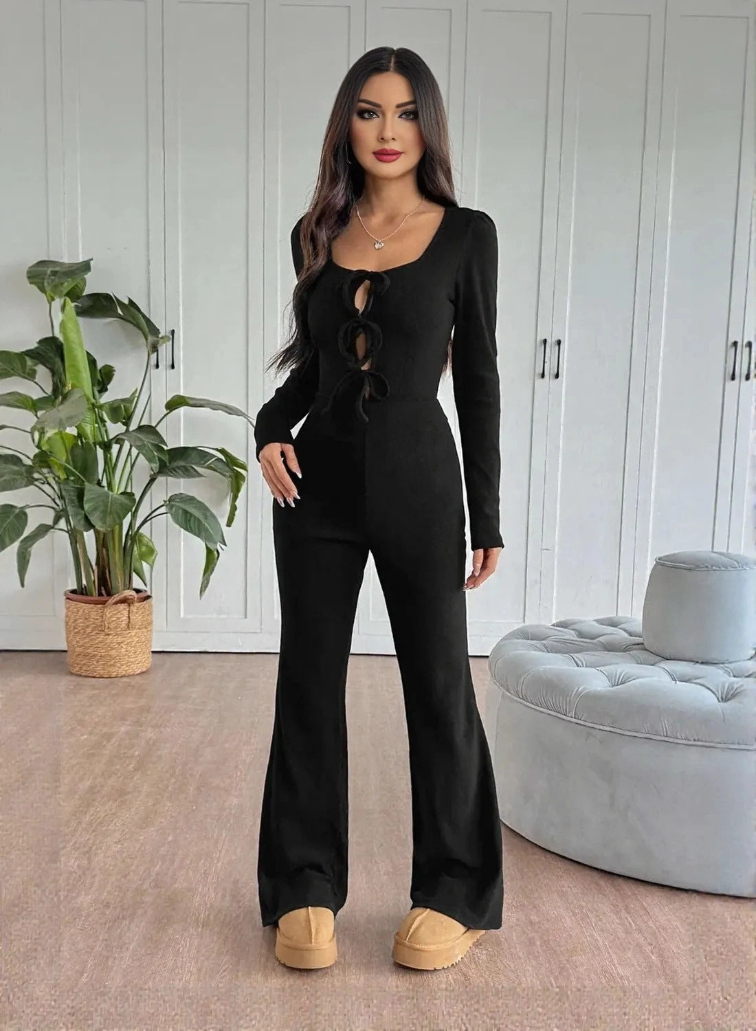 Flare leg design on women’s black party wear jumpsuit