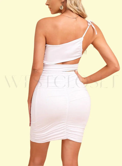 Model striking a pose in a sultry one-shoulder bodycon dress