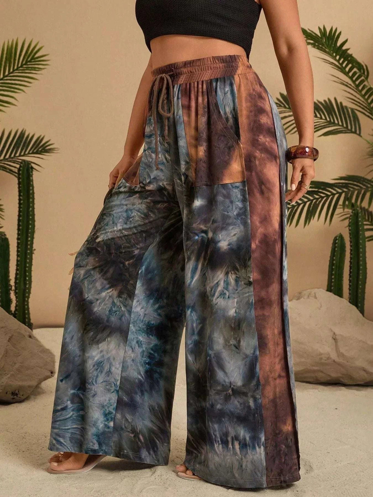 Side view of plus size wide leg tie dye pants