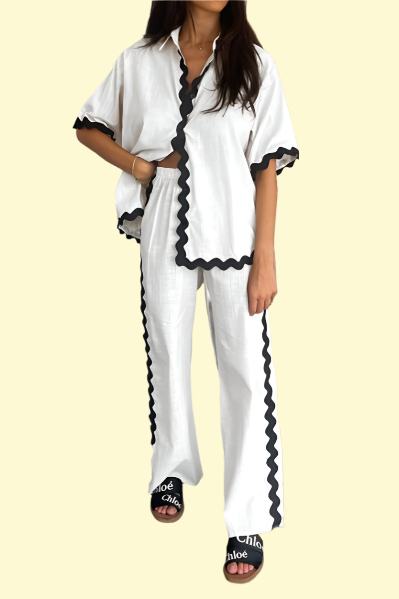 Sleek white two-piece outfit with contrast trim