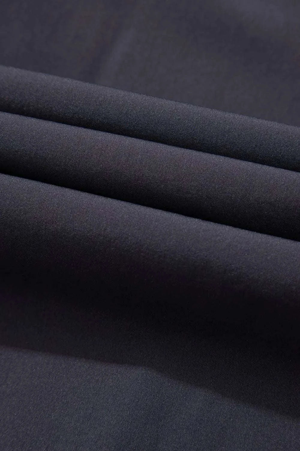 Stretch fabric detail of women activewear jumpsuit