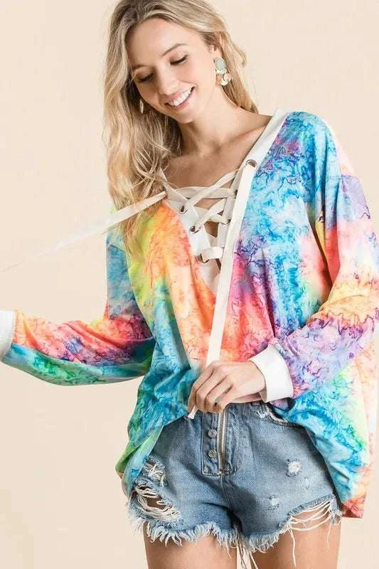 Trendy tie dye casual top paired with jeans for women