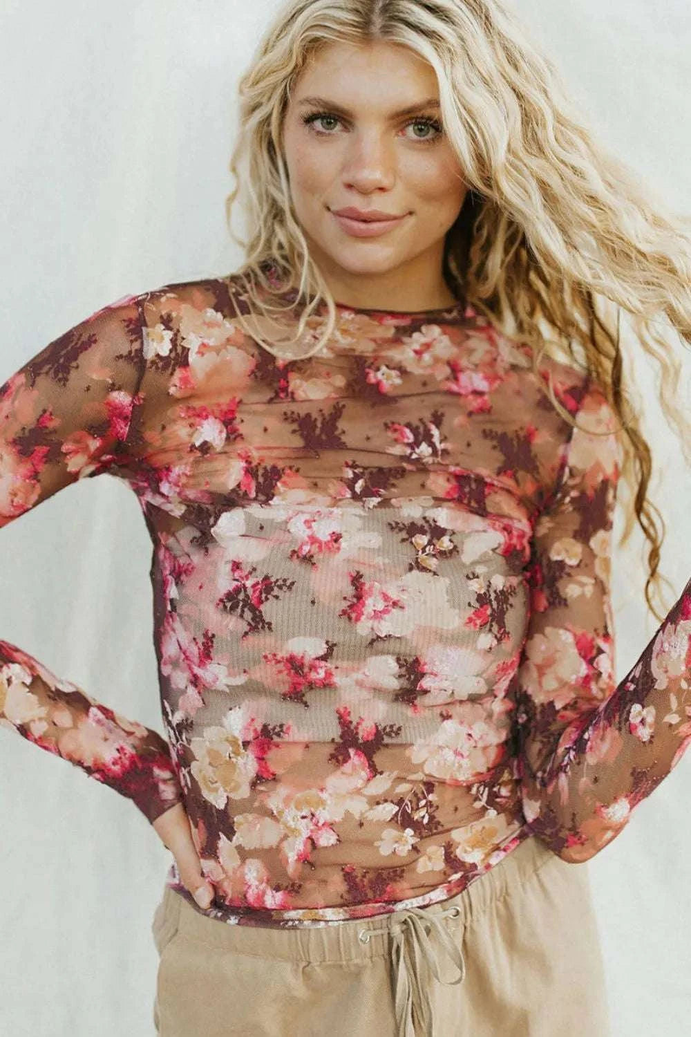 Women’s floral sheer top with mock neck design front view