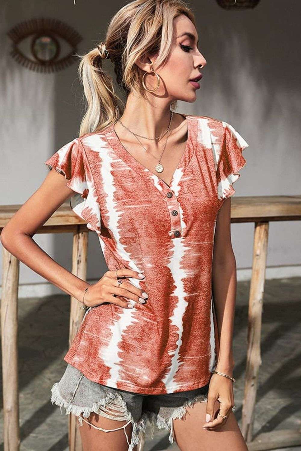 Women wearing tie-dye blouse with butterfly sleeves