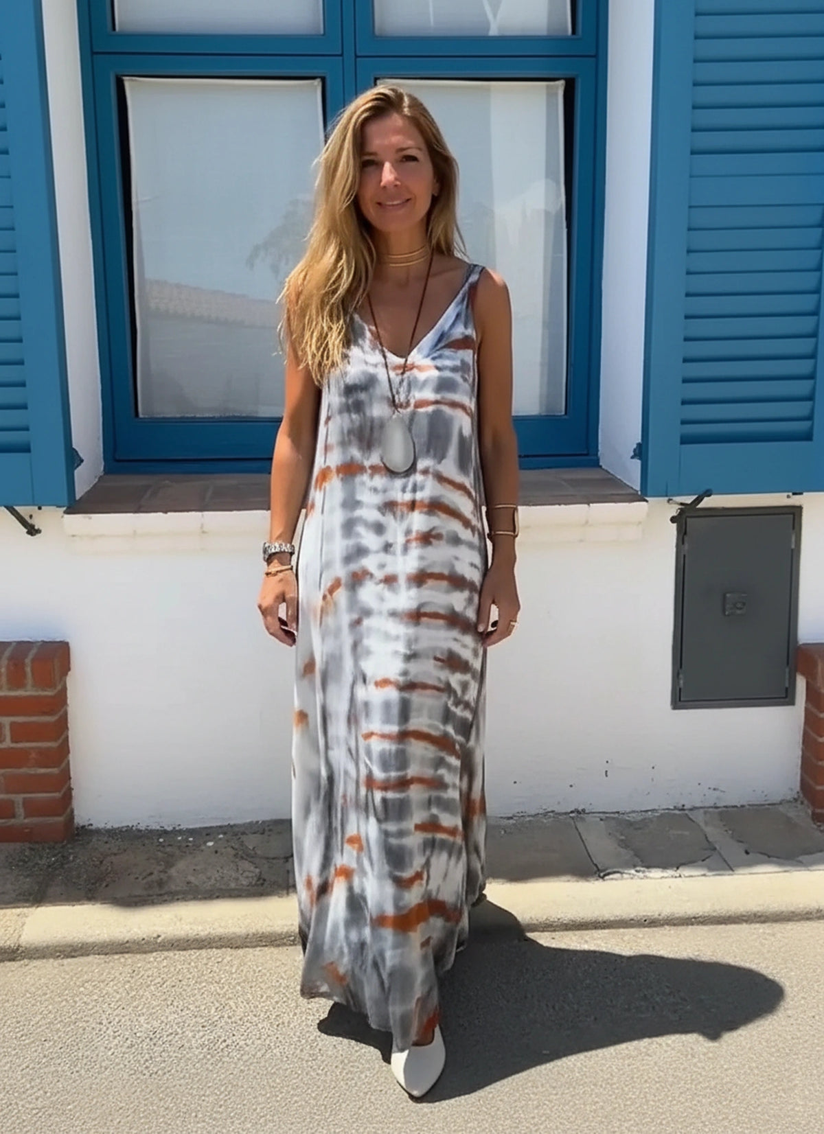 Women wearing tie-dye v-neck cami maxi dress in floral print