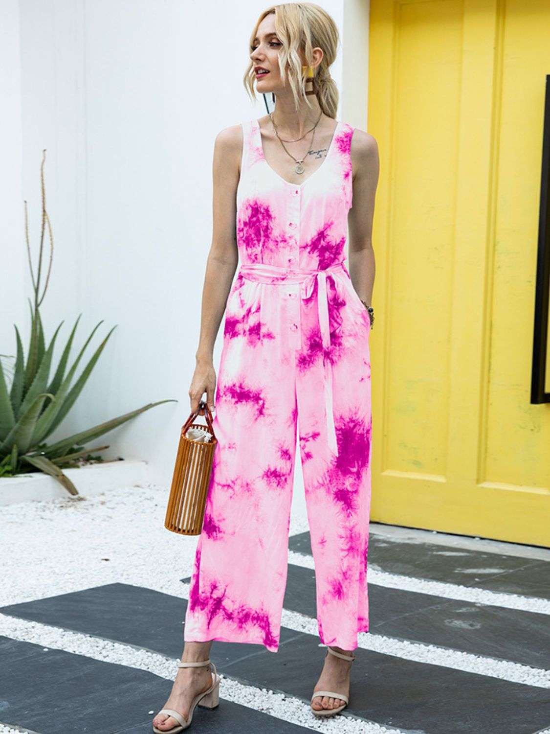 Women wearing tie dye jumpsuit styled for casual outings