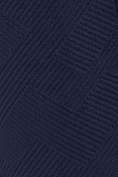 Close-up of the soft, slouchy fabric of the navy set