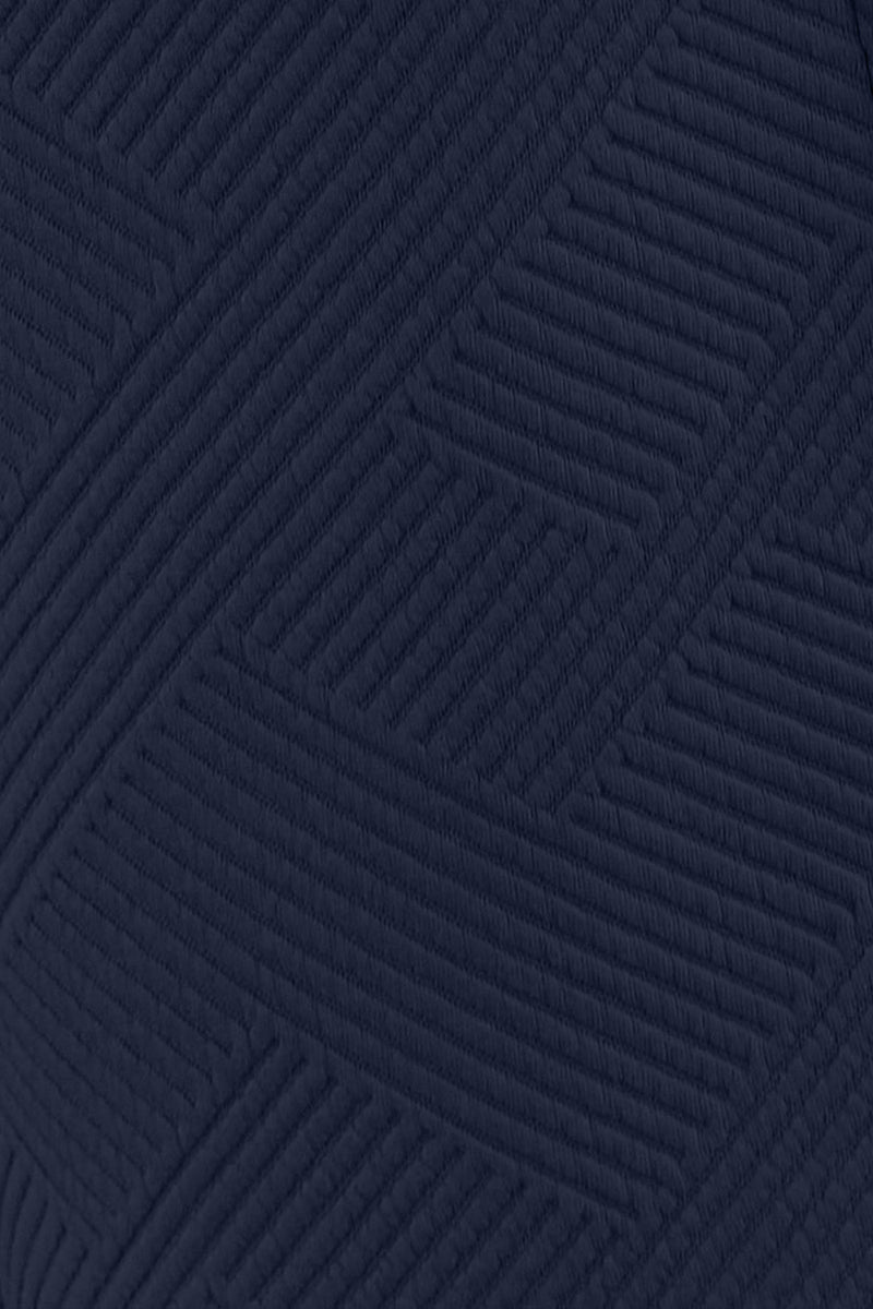 Close-up of the soft, slouchy fabric of the navy set