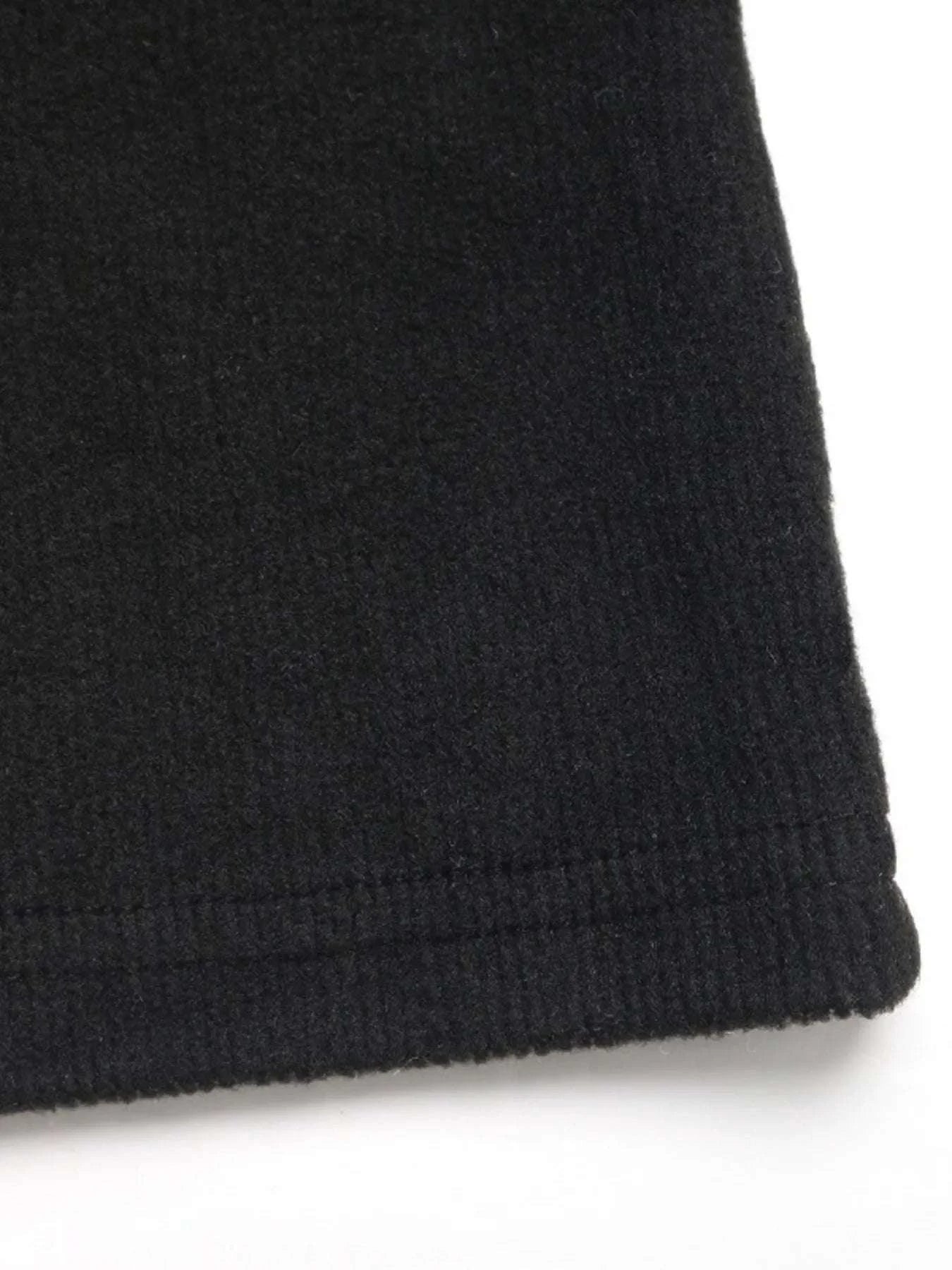 Fabric detail of black women’s jumpsuit by WestCloset